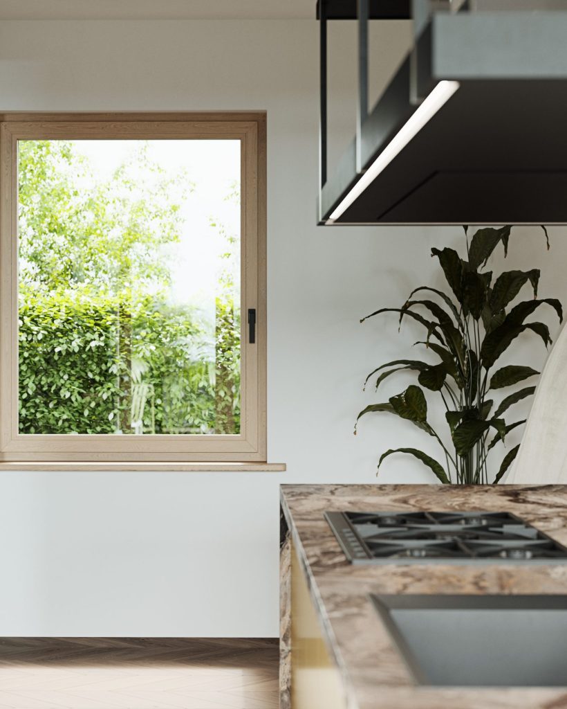 Cocina moderna con ventana que ofrece vistas relajantes a un jardín frondoso.